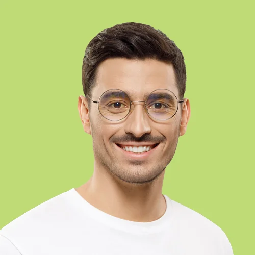 Smiling IT Consultant with Glasses on Green Background